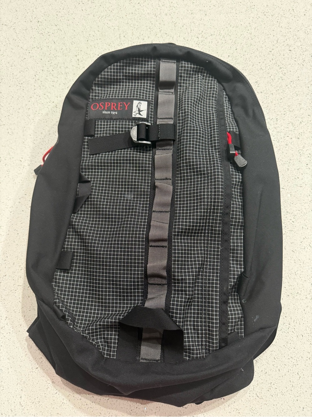OSPREY Black Backpack with Gray Grid and Red Accents